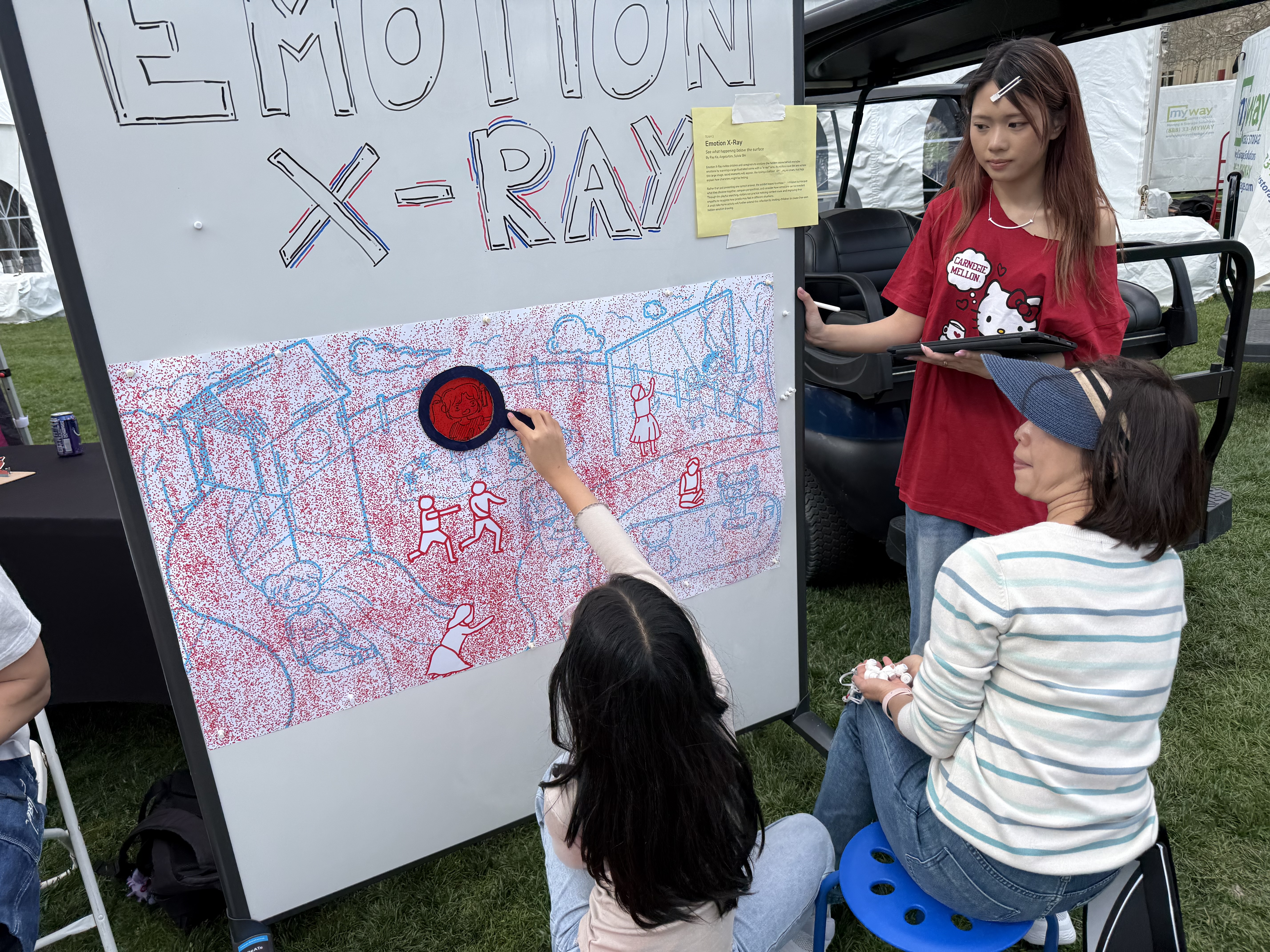 Family using the x-ray lens at carnival
